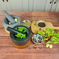 Large Mortar And Pestle Set, 2 Cup Capacity, Heavy Granite Stone Molcajete Bowl With Wood Base, Used In Guacamole, Salsa, Herb Crusher, Grind And Crush Spices And Nuts To Release Flavor, Black -KitchenAid Shop 51ERfIYlfzL