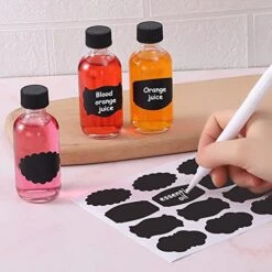 (Pack Of 72) 2oz Small Clear Glass Bottles(60ml) With Lids Boston Round Travel Bottles For Vanilla Hot Sauce Juice Whiskey Liquid Come With 72 Labels,5 Funnels,5 Droppers,1 Brush&Chalk Marker -KitchenAid Shop 51NrkArN70L
