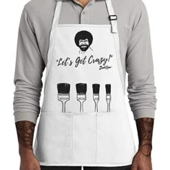 Bob Ross Apron | Perfect For Women, Men, And Kids | Features Paint Brush Pockets | White Canvas 100% Cotton Material | Great For Painting And Cooking | Unique Gift For Art Enthusiasts | Comfortable